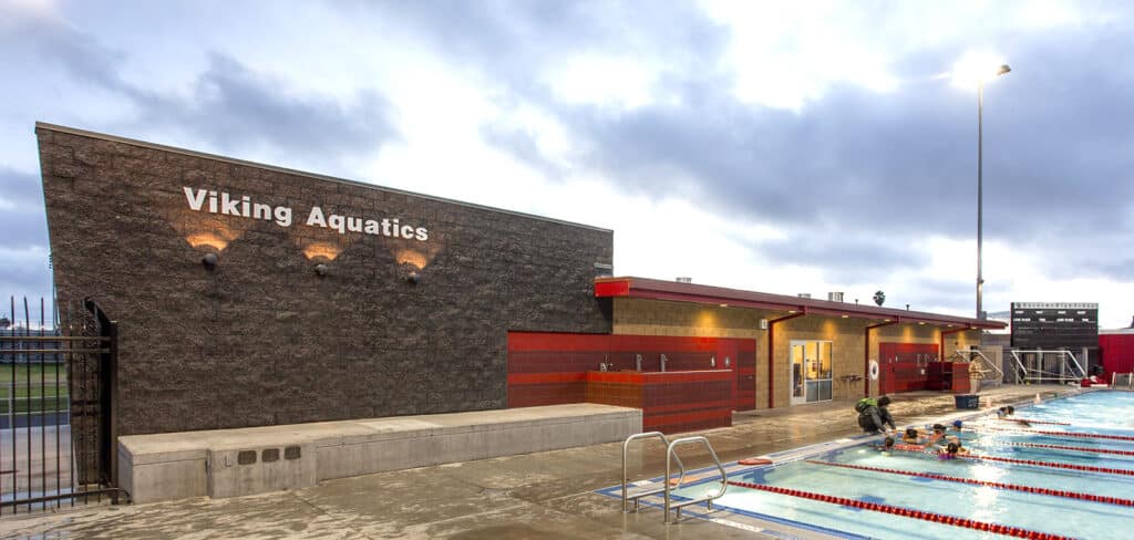 Exterior of Viking Aquatics high school aquatic center next to competition pool.