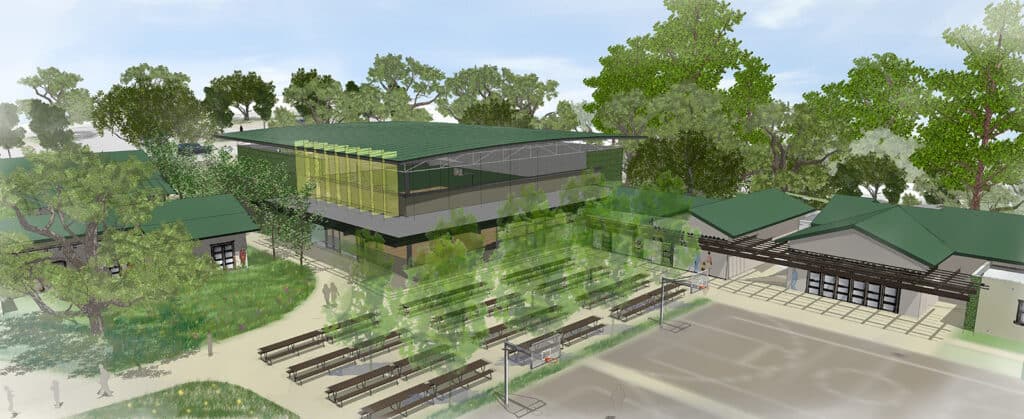 A colorful bird's-eye architectural rendering of a school campus. It features a large central building with a green roof, a basketball court, and rows of outdoor picnic tables shaded by trees.