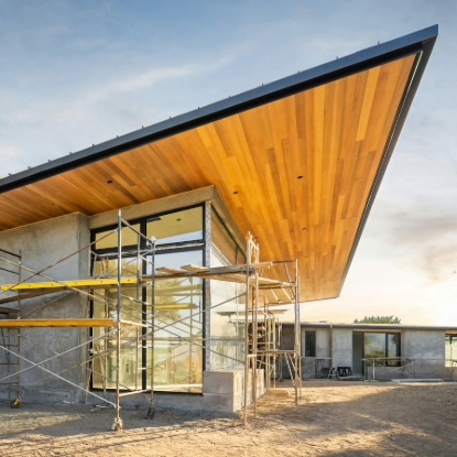 exterior of home showing underneath roof with sky above