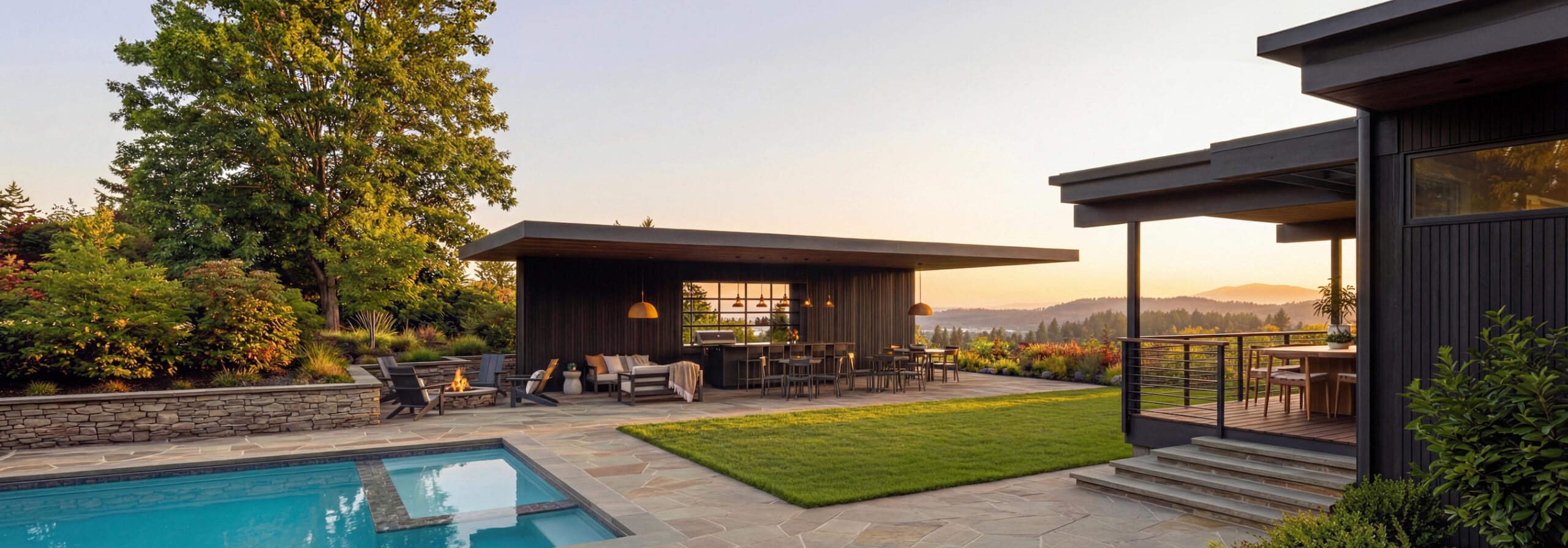 Modern hillside residence with pool, outdoor pavilion, and landscaped garden overlooking the Portland area at sunset.